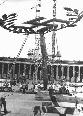 A Maypole topped with a swastika is raised for a May Day parade in the Lustgarten in Berlin.