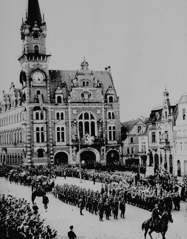 In the aftermath of the Munich agreement, which turned the Sudetenland of Czechoslovakia over to Germany, German troops march into ...