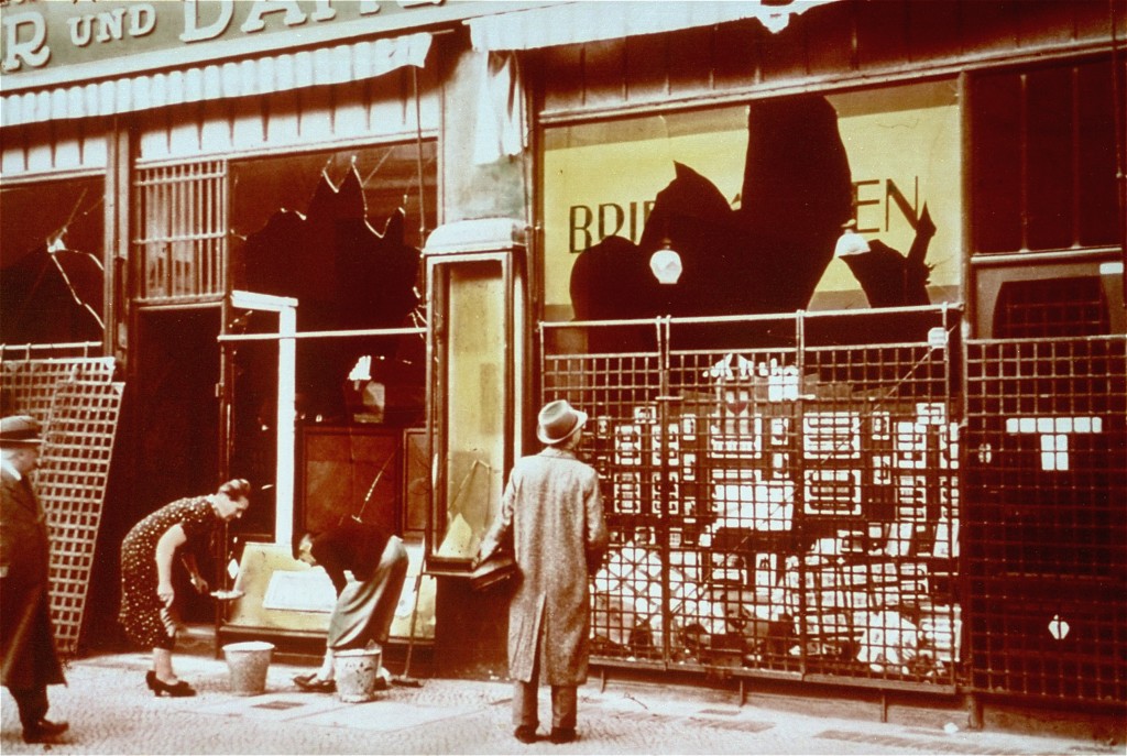 Storefronts of Jewish-owned businesses damaged during the Kristallnacht ("Night of Broken Glass") pogrom.